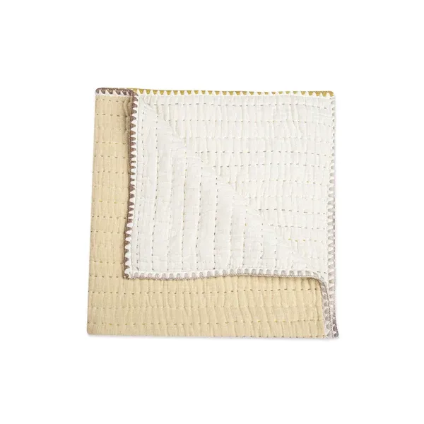 Crane Kendi, couverture piquée à pompons